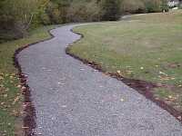 The finished pathway blends in naturally with the park, being contained the aggregate is held within the path.