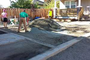 Volunteers prepare the parking area for a CORE Gravel installation.